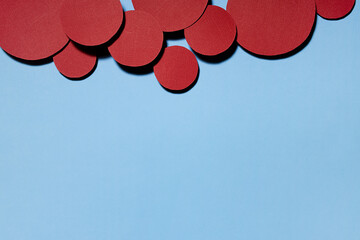 Poster - colorful abstract background with red textured circles as decorative swarm, border with copy space f