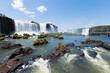 Spectacular view of Iguazu Falls on a sunny day, National Park in Brazil. A panoramic view of the waterfalls.