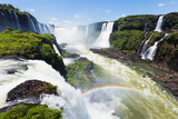 Spectacular view of Iguazu Falls on a sunny day, National Park in Brazil. The closest view of the waterfalls making a lovely rainbow