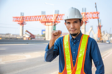 Wall Mural - Asian Engineer construction are worker employee working by safety control helmet on site building