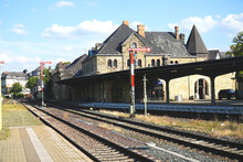 Historic Train Station In Goslar With Railroad Tracks, Signals And The Old Station Building Made Of Natural Stones, Harz Mountains, Germany, Europe