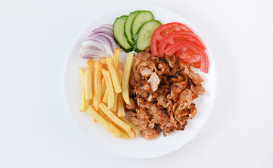 Doner salad plate, kebab chicken meat on white plate. Turkish food. Isolated on white background. Flat lay