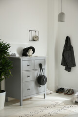 Poster - Grey chest of drawers in stylish room. Interior design