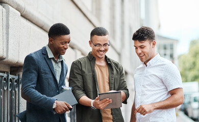 Poster - Casual group of IT engineers preparing for a meeting on a digital tablet outside together. Diverse team of happy technicians talking and reading plans and strategy for a startup or project