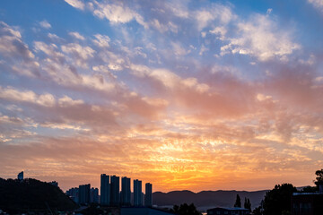 Wall Mural - dramatic golden sunset clouds sky over the south korea countryside