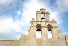 Historic Spanish San Antonio Texas Mission San Juan White Bell Exterior On A Cloudy Blue Day