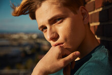 Young Blond Man Resting On Roof