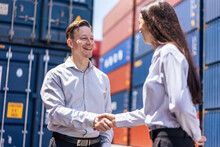 Caucasian Businesswoman And Businessman Worker Wor In Container Port