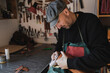 © ADDICTIVE STOCK - Man holding leather bag