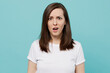 © ViDi Studio - Young dissatisfied annoyed displeased sad irritated caucasian woman 20s she wear white t-shirt look camera isolated on plain pastel light blue cyan background studio portrait People lifestyle concept