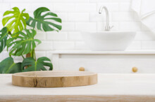 Round Wooden Podium For Product Display On Blurred Bathroom Background