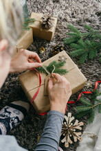 Woman Wrapping A Christmas Present