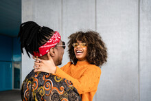 Stylish Black Couple Embracing And Kissing On Street