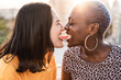 © ADDICTIVE STOCK - Romantic lesbian couple sharing snack outdoors