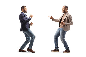 Full length profile shot of two young professional men dancing