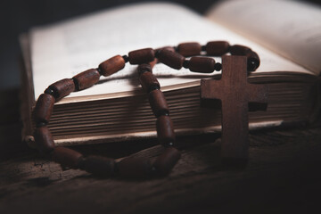 wooden cross on the book