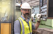 © Jack Tamrong - Caucasian engineer man working with power control system in engineering machinery factory, Engineer concept