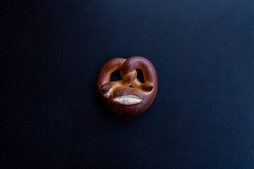 Top view of a pretzel on the dark background