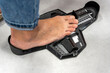 woman Measuring Shoe Size in storage. device determining length foot