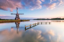 Landscape Of A Windmill At Paterswoldsemeer Lake At A Soft Sunset