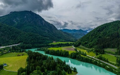 Poster - Scenery of the Danube river with green hills and gloomy clouds in the background, Austria