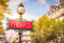 Ornate Retro Metro Sign Entrance In Paris At Sunrise, France