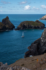 sailboat boat ship sailing swimming bay Kynance Cove cornwall england coast landscape sea ocean water blue summer holidays view 