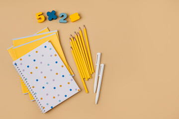 Wall Mural - School stationery supplies on beige background. Concept back to school.  Primary school or preschool.