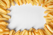 © New Africa - Frame of delicious french fries on white background, flat lay. Space for text