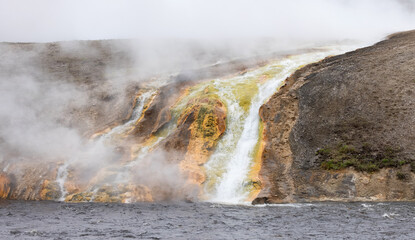 River and Hot spring Geyser with colorful water in American Landscape. Yellowstone National Park, Wyoming, United States. Nature Background