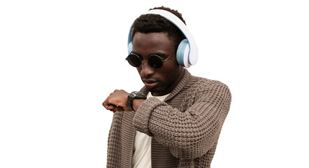 Portrait of african man with smartwatch using voice command recorder or takes calling in wireless headphones listening to music isolated on white background