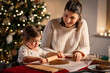 © Syda Productions - family, cooking and winter holidays concept - happy mother and baby daughter with rolling pin making gingerbread cookies from dough at home on christmas