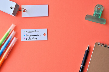 Poster - There is word card with the word Application Programming Interface on the desk.