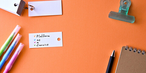 Poster - There is word card with the word Platform as a Service on the desk.