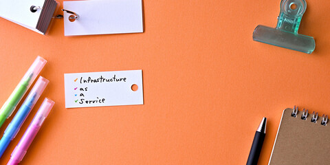Poster - There is word card with the word Infrastructure as a Service on the desk.