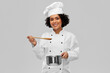 © Syda Productions - culinary and people concept - happy smiling female chef in toque with saucepan cooking food over grey background