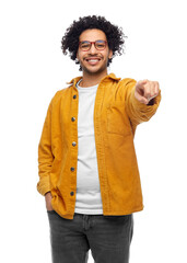 Wall Mural - people and fashion concept - happy smiling man in glasses and yellow jacket pointing finger to camera over white background