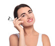 © New Africa - Woman with eyelash curler on white background