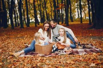 Wall Mural - Family with cute kids in a autumn park