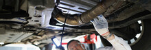 Man Repairman Fixing Car In Workshop Closeup