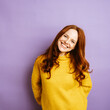 © contrastwerkstatt - Young redhead woman laughing at camera