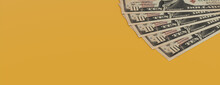 Ten Dollar Bills On A Yellow Surface. Wealth Concept Banner With Copy-space.