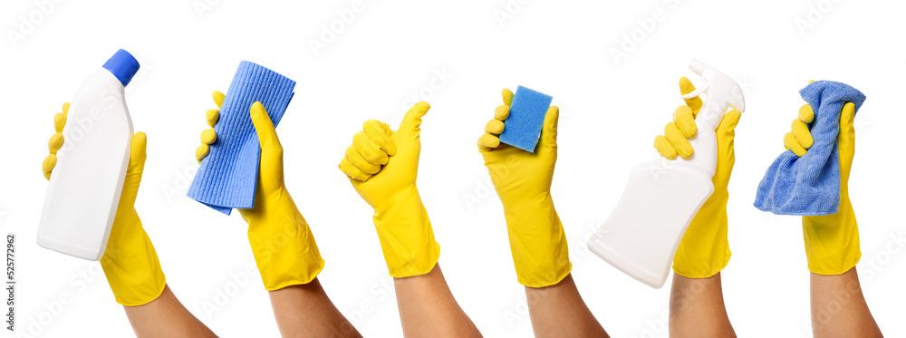 hand with yellow rubber glove holding cleaning supplies on transparent ...