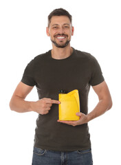 Wall Mural - Man pointing at yellow container of motor oil on white background