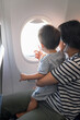 Baby on board looking out of an airplane window