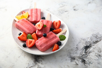 Wall Mural - Traditional homemade berry popsicles on a plate