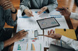 © Natee Meepian - Business team colleagues meeting to conference professional investor working a new marketing business strategy project discussion and analysis data chart and graph, finance and accounting concept.