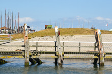 Texel, Netherlands. August 2022. Broken Mooring Posts In The Harbor Of Oudeschild.