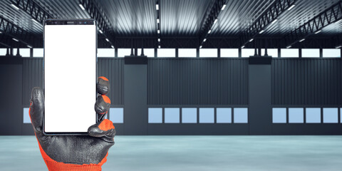 Poster - Phone in hand. Smartphone template inside empty building. Concept of renting building for warehouse. Phone with white screen. Renting warehouse space. Location for warehouse company. Art focus.