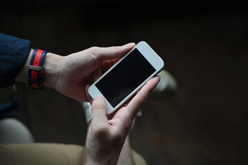 Poster - Close up of man's hands holding mock up smartphone, Empty screen of smartphone.